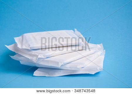 Menstruation Sanitary Pad For Woman Hygiene Protection. Critical Days. Medical Conception On The Blu