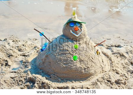 Fun Sand Figure On The Shore. To Celebrate The New Year In The Tropics. Winter Vacation At Sea. To L