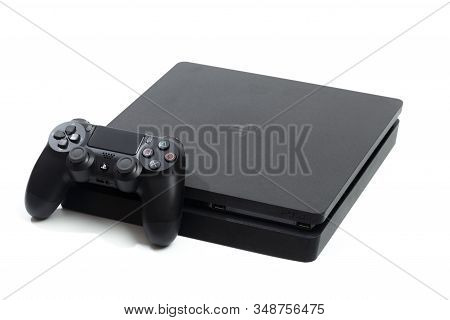 Russia, Oktober 24 2019: Sony Playstation 4 Game Console And Controller, Closeup On A White Backgrou