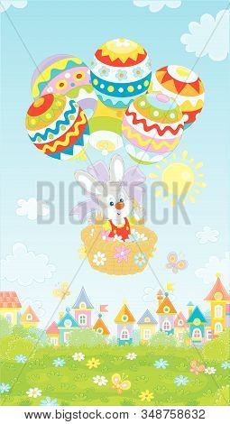 Little Easter Bunny Flying In Its Holiday Basket With Colorfully Decorated Balloons Above A Small To