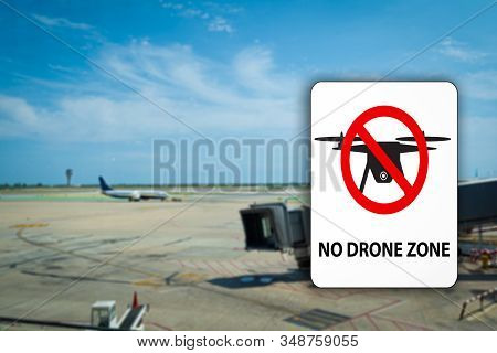 No Drone Flying Warning Sign Witha Generic Airport Blurred Background