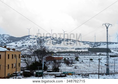 View Of The Snowy Mountains With The Electric Mills In Barracas