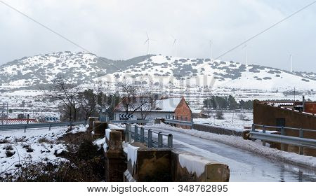 View Of The Snowy Mountains With The Electric Mills In Barracas