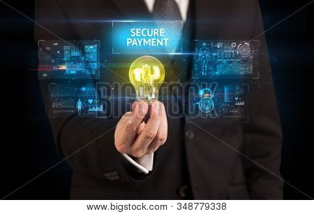 Businessman holding lightbulb with SECURE PAYMENT inscription, online security idea concept