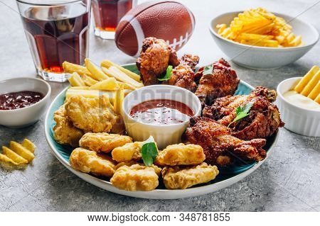Table Fof Tasty Snacks For Beer Prepared For Watching Sports On Tv. Chicken. Chicken Wings, Chicken 