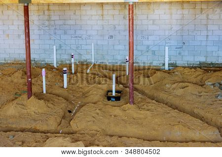 Pex And Drain Sewer Pipes In Home Basement Assembling System Of Sanitary Pipes In The Ground