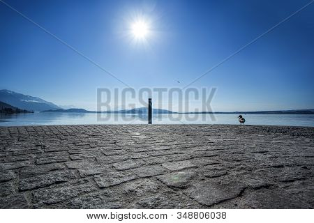 Peaceful Day On The Pier On Lake Zug, Switzerland