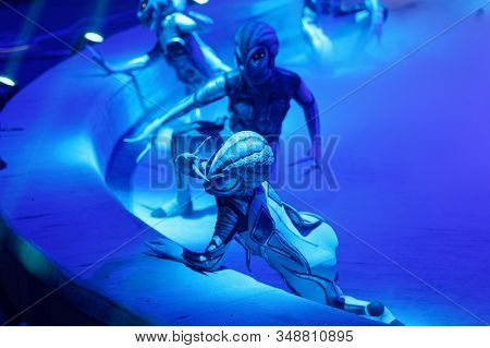 ST. PETERSBURG, RUSSIA - DECEMBER 27, 2019: Circus actors dressed as extraterraneans on the circus arena during the premiere of the show OFU. Landing in Saint-Petersburg