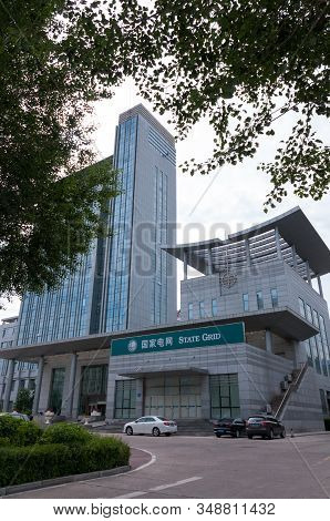 China, Heihe, July 2019: Office Building On Heihe City Street In Summer