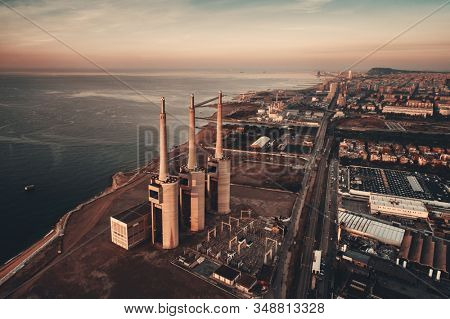 Besos thermic power plant aerial view at sunrise in Barcelona coast Spain.