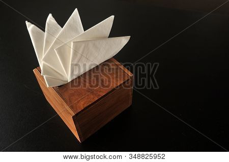 Tissue Box Made Of Wood On The Black Background.