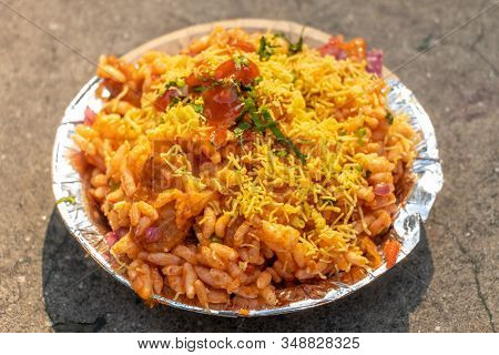 Bhel Puri Or Bhelpuri Chaat In Paper Bowl, Selective Focus