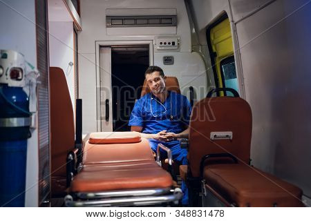 Corpsman Sits And Smiles In The Ambulance Car