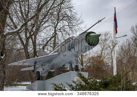 Mig-21 Fighter On A Street Stone Pedestal