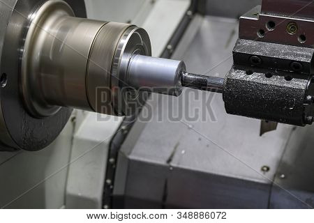 The Cnc Lathe Machine Boring Cut  At The Metal Shaft Parts. The Hi-technology Metalworking  Manufact
