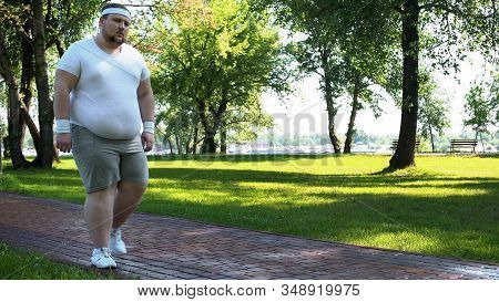 Man Walking Slowly, Exhausted After Running, Cardio Training For Weight Loss