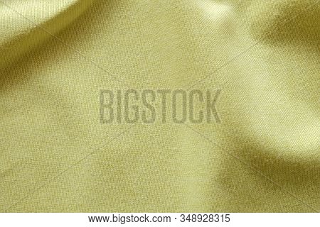 Bright Yellow Pastel Cloth Fabric Basket Weave Texture. Cotton Made Shirt Close Up Shot. Smooth And 