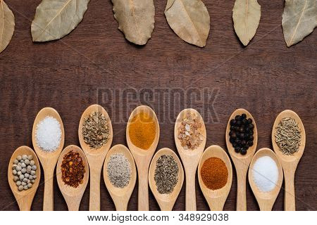 Various Spices In Wooden Spoon On Wood Table Background, Sugar, Pepper, Salt, Turmeric, Rosemary, Or