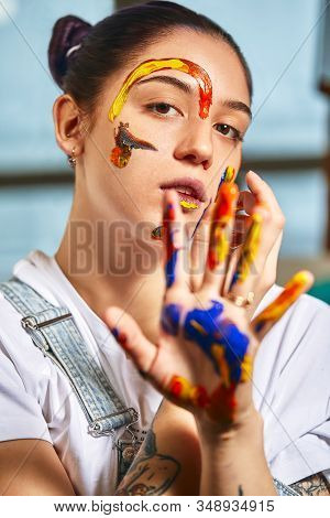 Beauty Art Concept, Portrait Of A Young Girl Painted With Different Colors Of Paint. Color Demos, Co