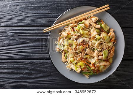 Serving Filipino Rice Noodle Bihon With Vegetables And Meat Close-up In A Plate. Horizontal Top View