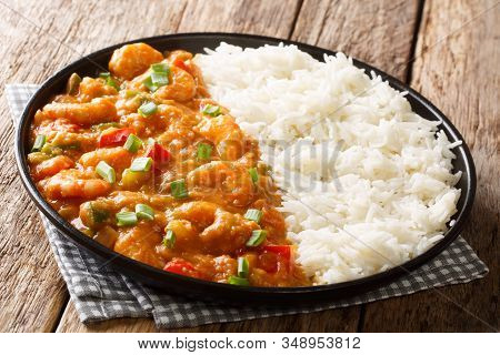 Spicy Traditional Shrimp Etouffee With Celery, Onion And Pepper With Sauce Served With Rice Closeup
