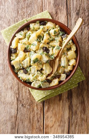 African Potato Salad With Yogurt, Herbs, Spices And Dried Olives Close-up In A Bowl. Vertical Top Vi