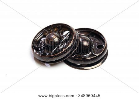 Close Up Of A Group Of Metal Snap On Buttons On White Background - Image