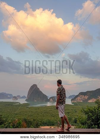 Young Men On Vacation In Thailand Visiting The Bay Of Phannga Famous For Its James Bond Island And V