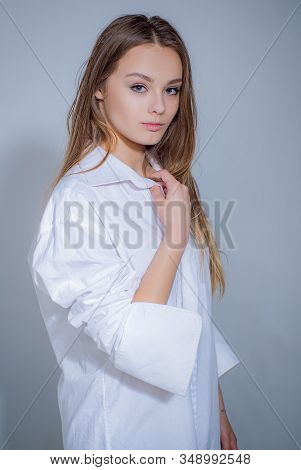 Caucasian Woman Model Posing Indoors. Girl Is Always Happy To Hear Interesting Storie