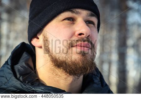 Face Of A Young Man With Messy And Untrimmed Beard And Moustache Close-up. Selective Focus. Outdoors