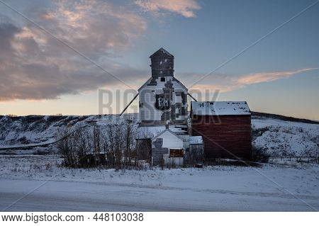 Sharples, Alberta - January 2, 2022: Old P&h Grain Company Elevator In The Ghost Town Of Sharples, A