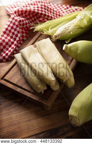 Tamales De Elote, Also Called Uchepos. Typical Mexican Dish. Can Be Served With Green Salsa And Acco