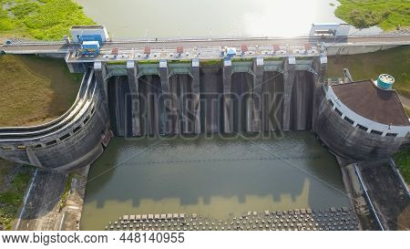 Water In Dam Concrete Spillway Infrastructure At Reservoir. Waterfall And Stream In Side Channel Spi