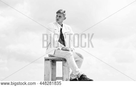 Be Your Own Compass. Single Guy Sit On Chair Cloudy Sky. Enjoying Rest. Summer Vacation. Travel And 