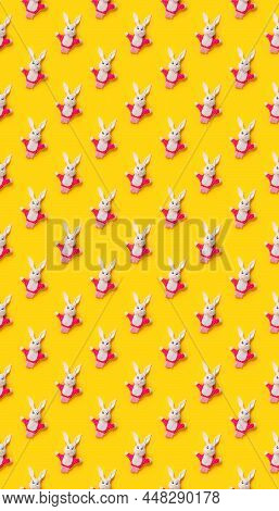 Seamless Pattern. Easter Bunnies Isolated On Yellow Background. Funny Texture. Education Toy Theater