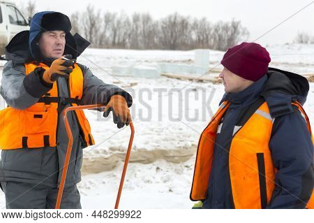 Portrait Of Installers On A Smoke Break