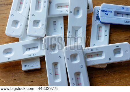 Pile Of Positive Covid-19 Rapid Home Lateral Flow Antigen Tests