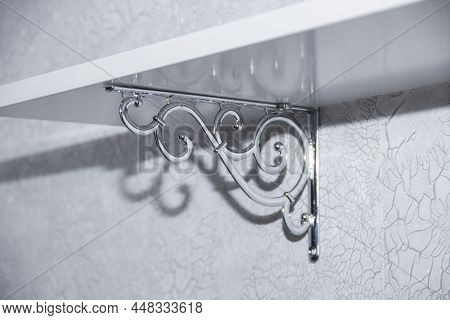 White Wall Shelf On Beautiful Brackets. Empty Wooden Shelves With A White Bracket On The Wall In The