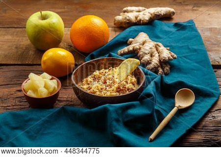 Couscous Masfouf With Dried Fruits And Nuts In A Plate On A Blue Napkin Next To Fresh Fruits. Horizo