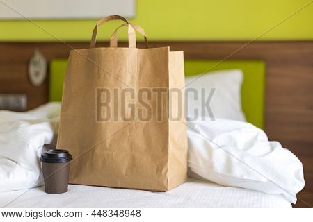 Delivery Food Craft Bag With Cup On The Bed On Sunny Day. Delivery In Any Weather Around The Clock T