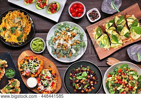 Healthy Plant Based, Low Carb Diet Table Scene. Overhead View On A Dark Wood Background. Vegetable N