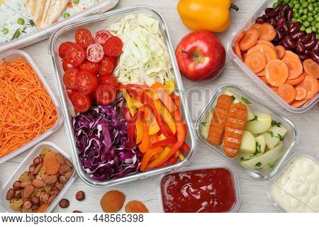 Set Of Containers And Fresh Food On White Wooden Table, Flat Lay
