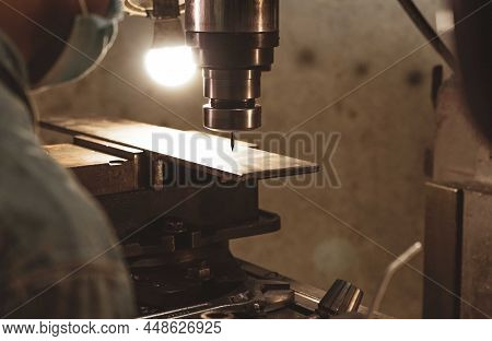 Milling Machine Working Near Worker With A Protective Mask. Tool For Cut Metal Workpiece. Vertical M