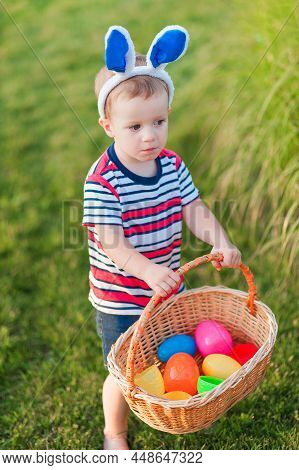 Toddler Eggs Hunters Close-up. Children Activity For Easter In Nature.