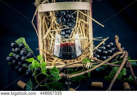 Wine Bottle, Glass A Corksrew And Grapes