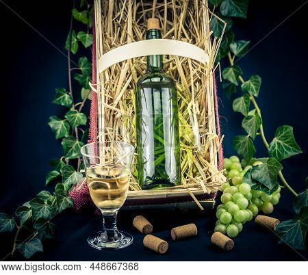 Wine Bottle, Glass A Corksrew And Grapes