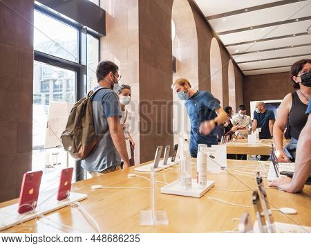 Paris, France - Sep 24, 2021: Busy Apple Store Atmosphere With Customers People Inspecting Looking A