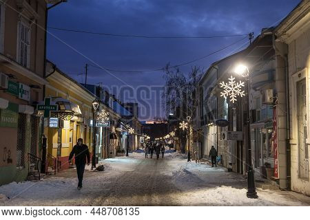 Pancevo, Serbia - January 23, 2021: Selective Blur On People Walking In The Snow On The Main Street 