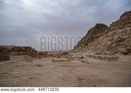Ruins Of The Small Pyramid Of Queen Henutsen Near Cheops Pyramid. Giza Plateau, Egypt. Unesco World 