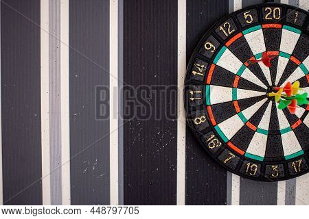 To Hit The Target With A Dart, After Many Failures. Motivation To Win. Holes In Wall From Not Hittin
